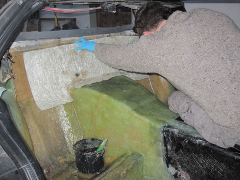 Constructing a rear seating area out of fresh fiberglass.